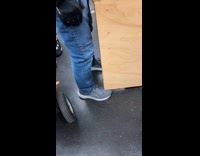 Men transporting bookshelf through subway train part 1