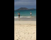 Two woman bikini photo shoot beach