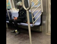 Guy wearing boba fett mask rides subway 