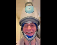 Man receiving TMS therapy makes face twitch