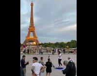 Man in a 360 equipment with the Eiffel Tower behind