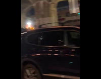 Pickup truck drives with flaming flat tire