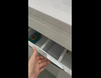 Kitten hiding inside of sink drawer 