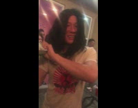 Guy in Steve Aoki halloween costume throws cake at friend face and misses