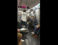 Man earphones in puts phone in between pants and buttcheek on subway train
