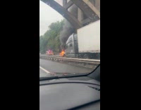 Submitter passing by burning car on parkway