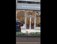 Guys sit at excavator driving around city