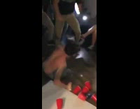 Guy bodyslams friend onto beer pong table