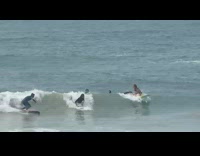 Guy crashes into other surfer falls into ocean 