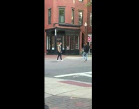 Guy jumps in the middle of street for photo