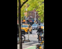 Bald shirtless man kneel middle of road