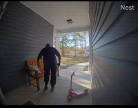 Delivery guy picks up pillow on floor