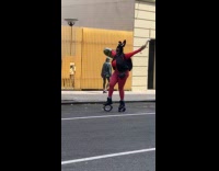 Woman wears kangaroo shoes in the street