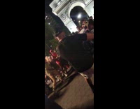 Man in black shirt raps to park audience