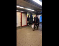 Man Christmas tree lights costume walk subway