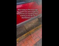 Man watching girlfriend film rain