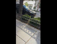 Vendor along street with christmas decor and clothes 