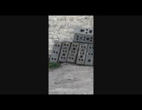 Bricks in front of the wall with various facial expressions