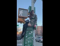 woman army dress street sign
