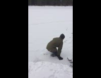 Guy jumps breaks ice falls frozen lake
