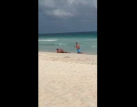 Person lie down pose for beach photo