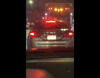 Car with white ight bet license plate 