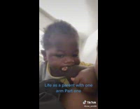 Mom lets baby chew on her missing arm 