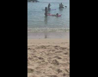 Lady poses laying on a floatie for photo 