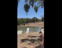 Guy on bicycle backflips ramp into lake 