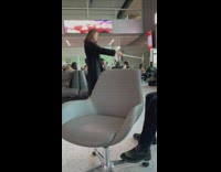 Woman in black coat selfie stick at the airport