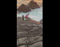 Collab IITW - Man in red bottoms poses on the beach rock