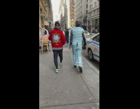 Guy wears suit made from face masks 