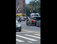 Guy ride tandem bike with skeleton family