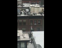 Grey sweater girl dances rooftop black dog 