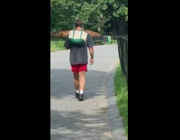 Guy green tote bag around head park