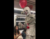 Pennywise the dancing clown with red balloon from It says we all float down here on subway train