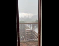 Submitter films strong storm from apartment balcony