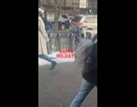 Man in leotard dancing on street