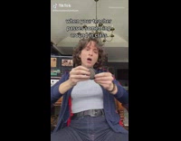 Student looks at item teacher passes around