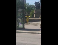 Model in Yellow Hops Down Stairs for Photo