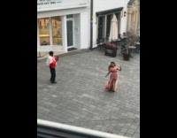 Woman in saree dances outside the store