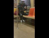 Guy wears bird beak mask 