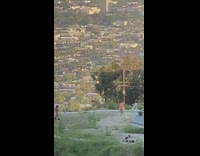 Girl orange dress dance windy cityscape view
