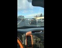 Black car with snow drives in Denver