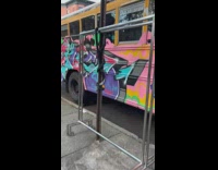 Graffiti and paint design on a parked party school bus