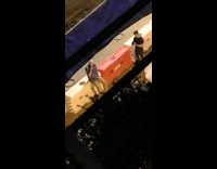 Two men photo shoot nighttime orange traffic barrier Part 2