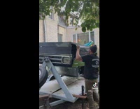 Guy spins flat car with person inside 