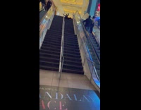 Woman falls backward on stairs 