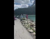 Woman silver long gown pictorial rocks river