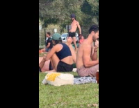 Man naked flexes for video at park